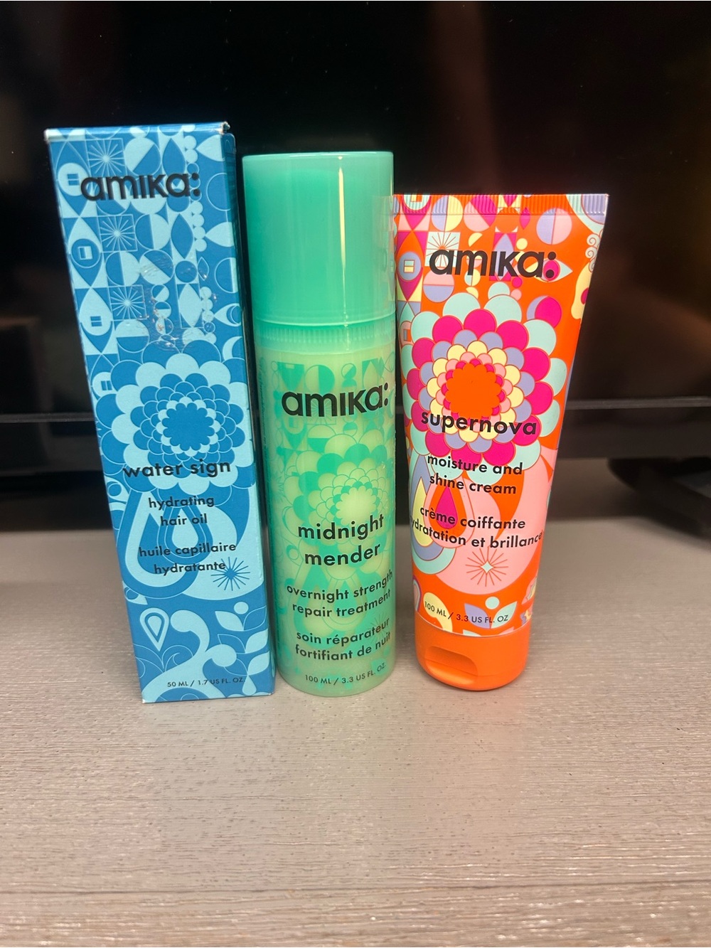 amika green and orange hair care trio